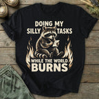 Printify T-Shirt While The World Burns T-Shirt