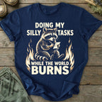 Printify T-Shirt While The World Burns T-Shirt